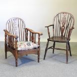 A wheelback open armchair, together with an oak wheelback reclining chair,