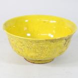 A late 20th century Chinese yellow glazed porcelain bowl,