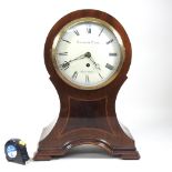 An unusually large Mappin and Webb mahogany cased balloon shaped mantel clock,