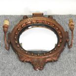 A Regency style convex twin branch girandole,