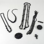 A collection of black bead necklaces,