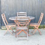 A hardwood circular garden table, 110cm,