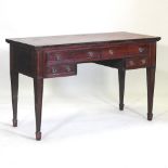 A Regency style mahogany desk, with a red inset writing surface,