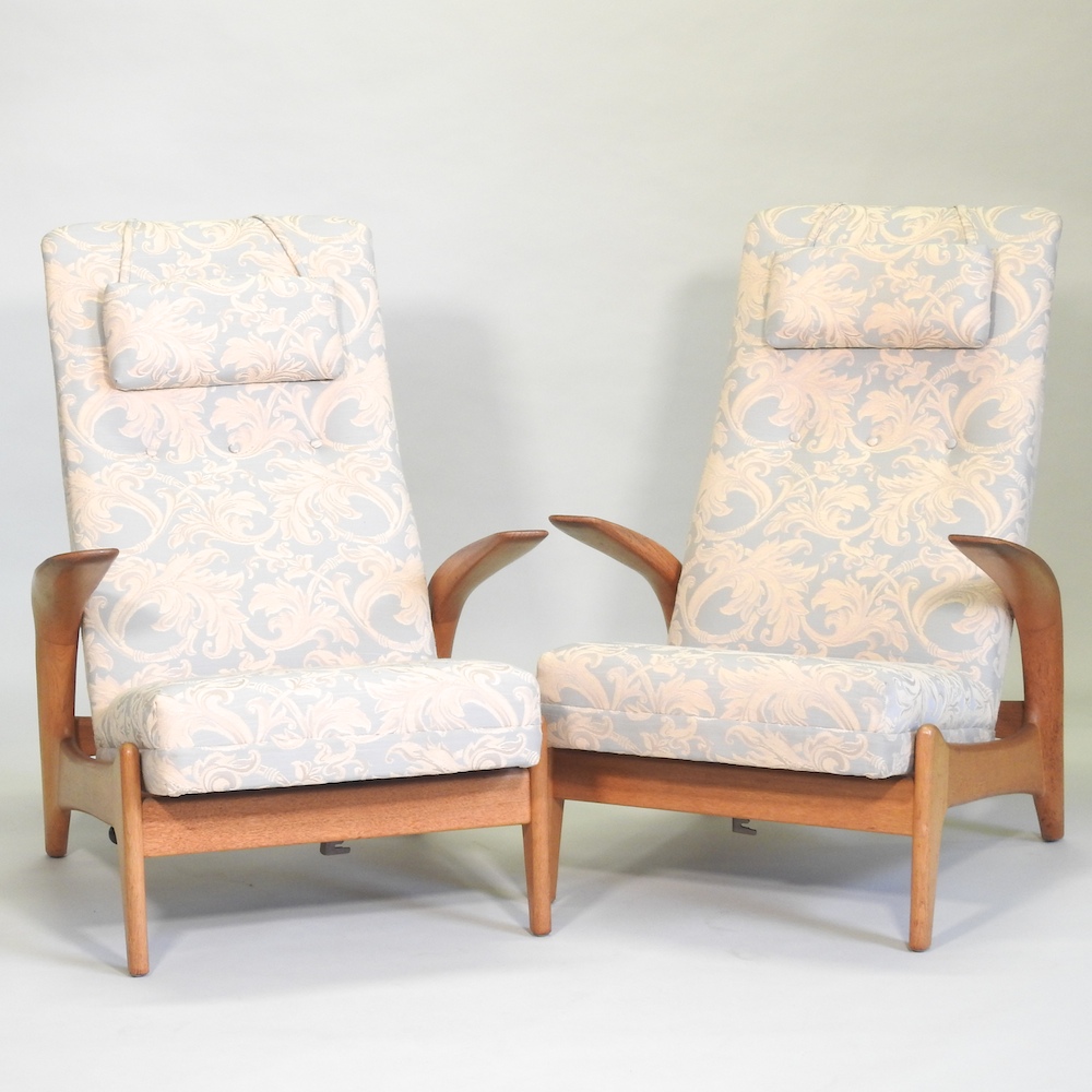 A pair of 1970's teak Gimson and Slater 'Rock n Rest' reclining armchairs,