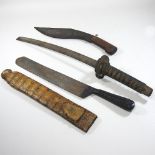 An early 20th century Japanese short sword, having a bound fish skin grip,