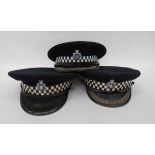 Three Post 1953 Police Officer‚' Caps black crown and body. Black patent peak with embroidery