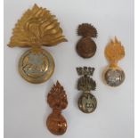 Five Various Fusilier Busby Grenade Badges consisting brass, Lancashire Fusiliers (slider