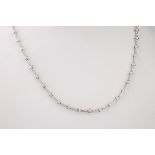 A diamond set 18ct white gold necklace, the white gold inset with over 3ct of very good brilliant