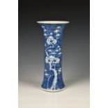 A Chinese porcelain blue and white gu form vase, 19th / early 20th century, painted with prunus