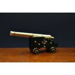 Trench Art interest -The 7th Queen's Own Hussars desk cannon, the trolley later painted in green,