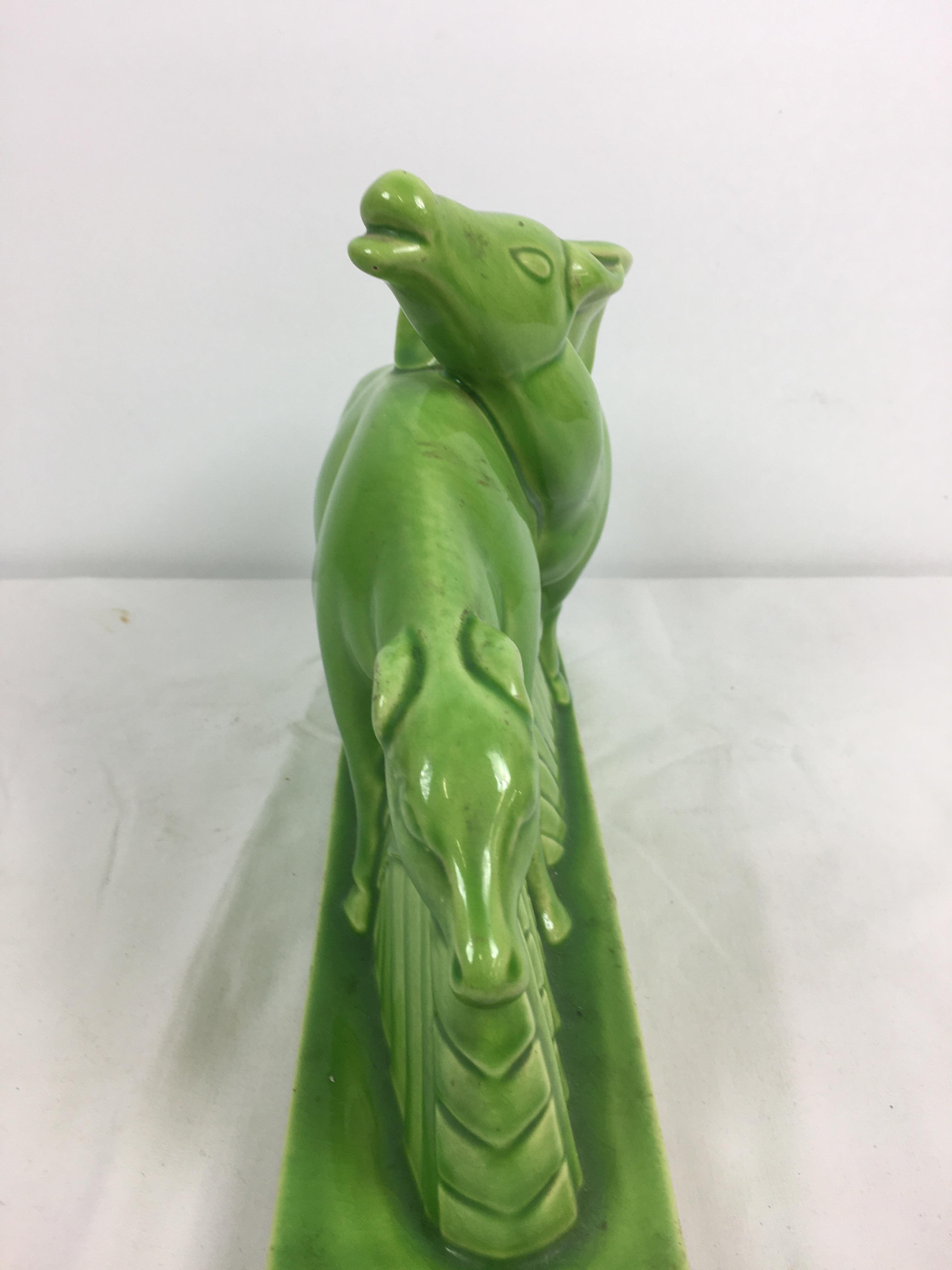 Charles Lemanceau - A French Art Deco green glazed pottery figure group of two stylized buffalo or - Image 5 of 11