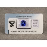 A 6.5ct cushion cut loose tanzanite stone, with deep violet blue colour and accompanied by an
