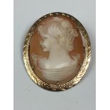 A 9ct yellow gold mounted shell cameo brooch, hallmarked Birmingham, 1920, 1 5/8in. (4.2cm.) long.