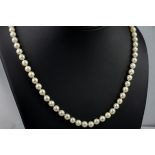 A pearl necklace with 9ct yellow gold clasp, the pearls approximately 5mm in diameter and the