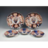 A pair of Japanese porcelain Imari scalloped chargers, late 19thy early 20th century, decorated in