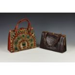 Two vintage 1950s-1960s handbags, one red faux-leather with peacock feather decoration to the