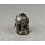 A miniature metal Indian elephant paperweight, the weight fashioned as a well detailed Indian