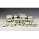 A New Hall hard paste porcelain part tea service, c.1800, painted in pattern no. 241, comprising a