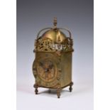 A lantern clock style timepiece, late 19th / early 20th century, with Roman dial and French single