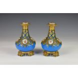 A pair of 19th century French opaline blue glass scent bottles, with pierced and engraved gilded