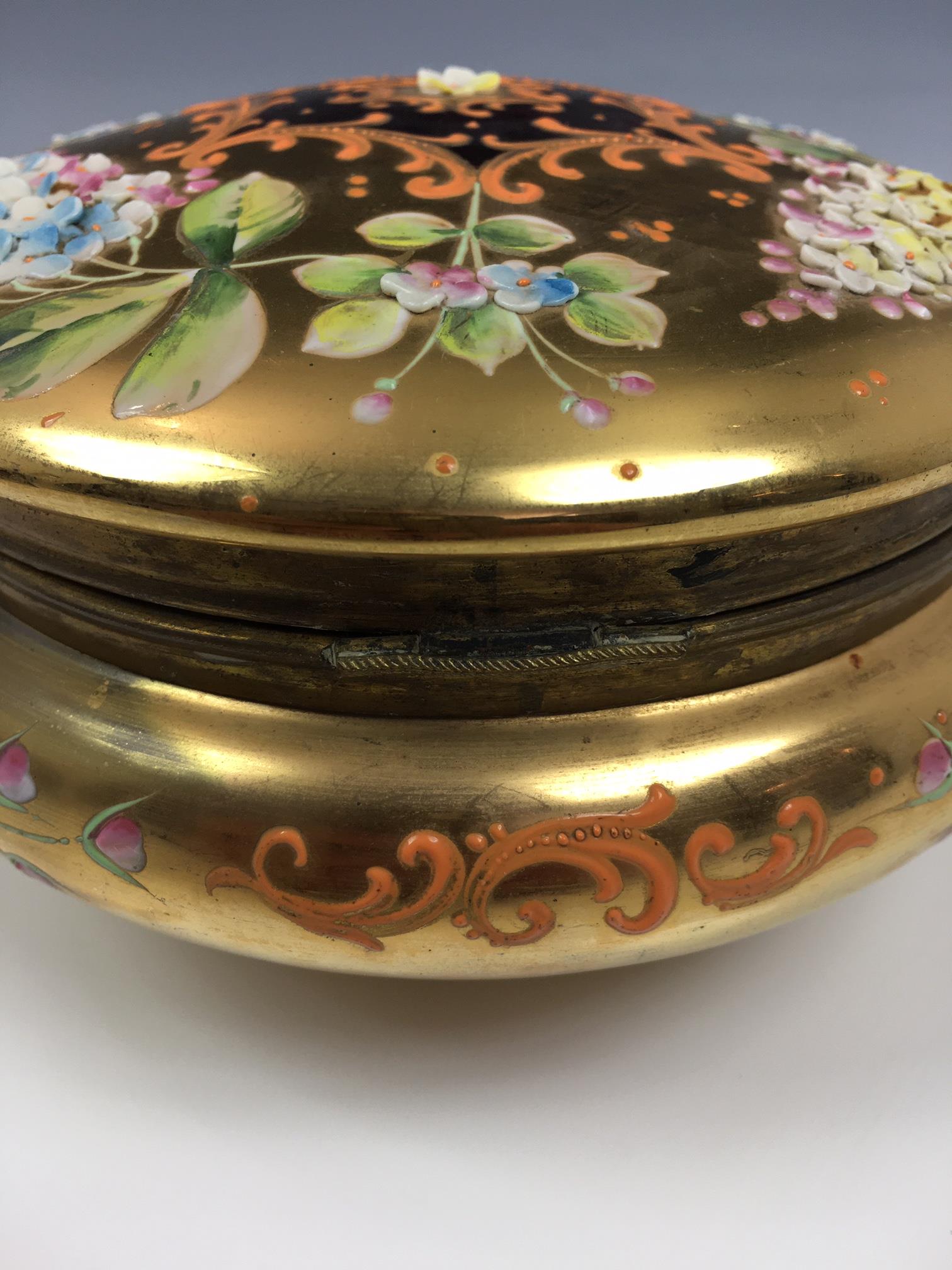 A French porcelain and gilt metal box, 20th century, painted with a floral reserve with gilt - Image 11 of 22