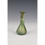 A Roman iridescent pale green glass unguentarium, 1st-2nd century AD, with flat, everted rim,