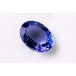 A 5.59ct oval cut tanzanite, accompanied by a certificate from the Canadian Gemological &