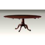 A large, good quality Georgian style mahogany single pedestal dining table, fourth quarter 20th