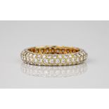 A Cartier 18ct yellow gold and diamond 'Mimi' ring, featuring a full eternity band decorated in 3