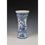 A Dutch Delft trumpet form vase, probably 19th century, of fluted, octagonal form, painted in blue