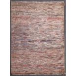 A contemporary handmade wool striped rag rug, 90¾ x 65in. (231 x 165cm.).