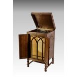 A oak cased free standing " His Masters Voice " model 163 cabinet gramophone, lacking sound box, the