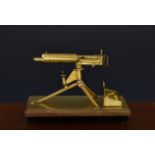Trench Art interest - A model of ' German Maxim Machine Gun ' desk stand / key tray, the superb
