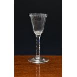 A fine 18th century fluted, engraved and facet cut wine glass, c.1770, the pointed round funnel bowl