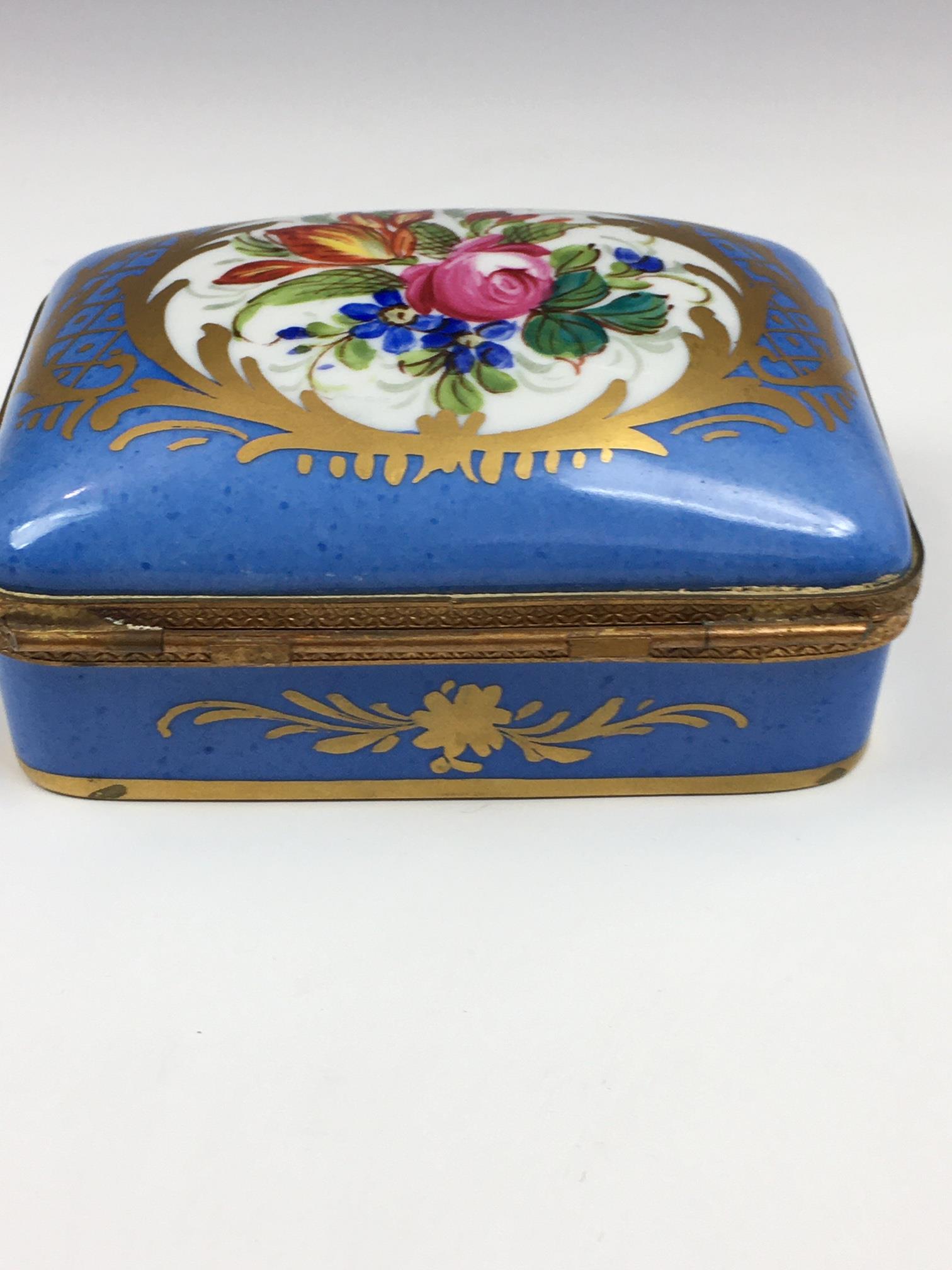 A French porcelain and gilt metal box, 20th century, painted with a floral reserve with gilt - Image 20 of 22