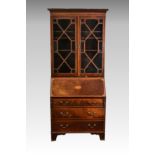 An Edwardian and earlier mahogany and satinwood bureau bookcase, the earlier George III glazed