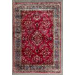 An antique Shiraz part silk rug, with central floral pendant medallion and spandrels, flowers and