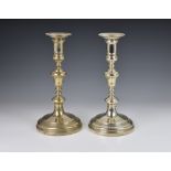 A pair of George V silver candlesticks in the Queen Anne style, William Comyns & Sons Ltd, London,