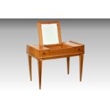 A mid-century French satin walnut dressing table, 1940s-50s, the diamond parquetry lifting top