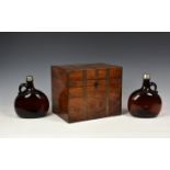 A 19th century brass bound mahogany twin compartment decanter box and flagons, the hinged cover