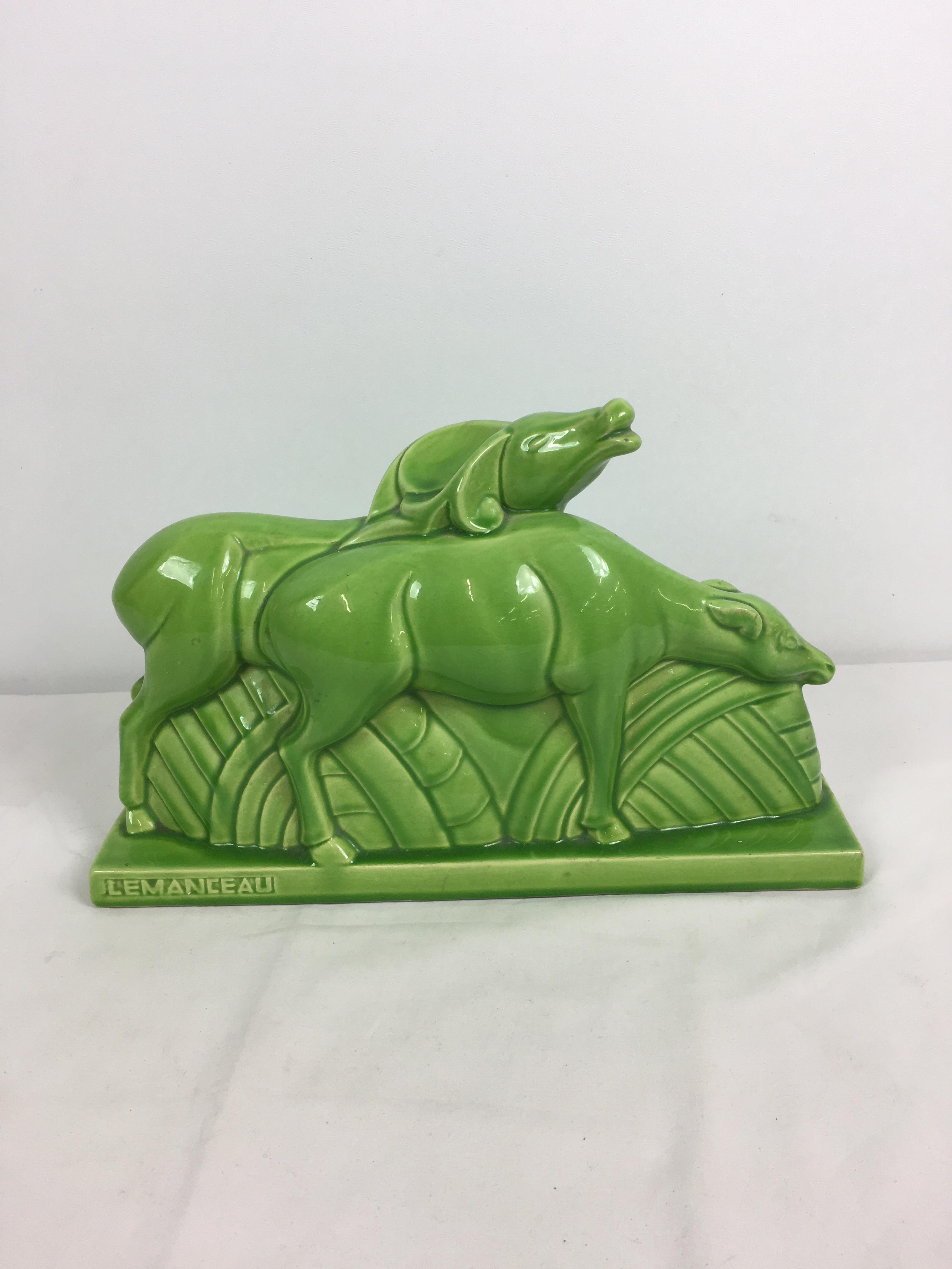 Charles Lemanceau - A French Art Deco green glazed pottery figure group of two stylized buffalo or - Image 2 of 11