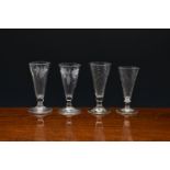 Four late 18th century dwarf ale glasses, c.1780-1800, two with funnel bowls, both engraved with