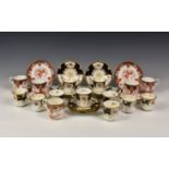 A collection of Coalport tea cups and saucers, blue and white ground, gilt decorated with floral