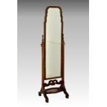 A Queen Anne style walnut cheval mirror, 1920s-30s, the shaped top mirror on a stand with turned