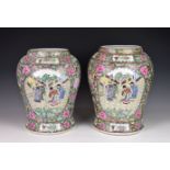 A pair of Chinese porcelain vases, 20th century, of baluster form, painted in a famille rose palette