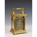 A mammoth gilt brass carriage clock, early 20th century, the Corinthian column case with folding