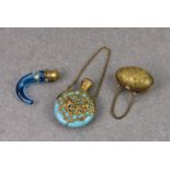 A Victorian blue glass horn shaped scent bottle, enamel painted with floral ring and having brass