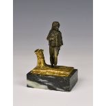 A parcel gilt bronze figure, possibly Russian, of a young gentleman with sword, his satchel with