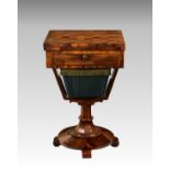 A William IV rosewood games work table, the satinwood and rosewood games board top swivelling and