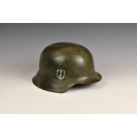 A WWII German SS M-42 helmet, single decal (retouched), having original liner, size (58), the helmet